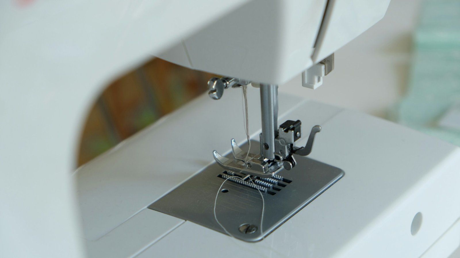 white sewing machine on table